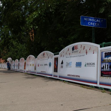Sponsor signs along fence for festival